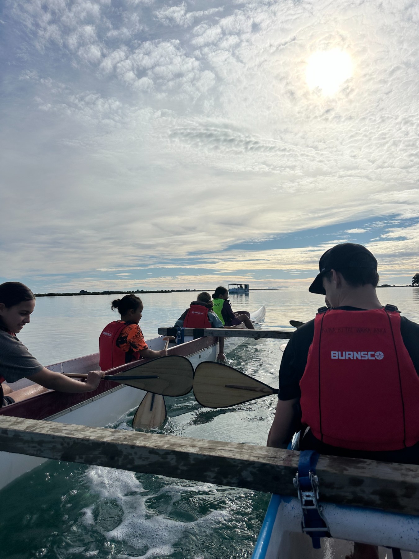 ​Tamariki paddling on Ohiwa Harbour
