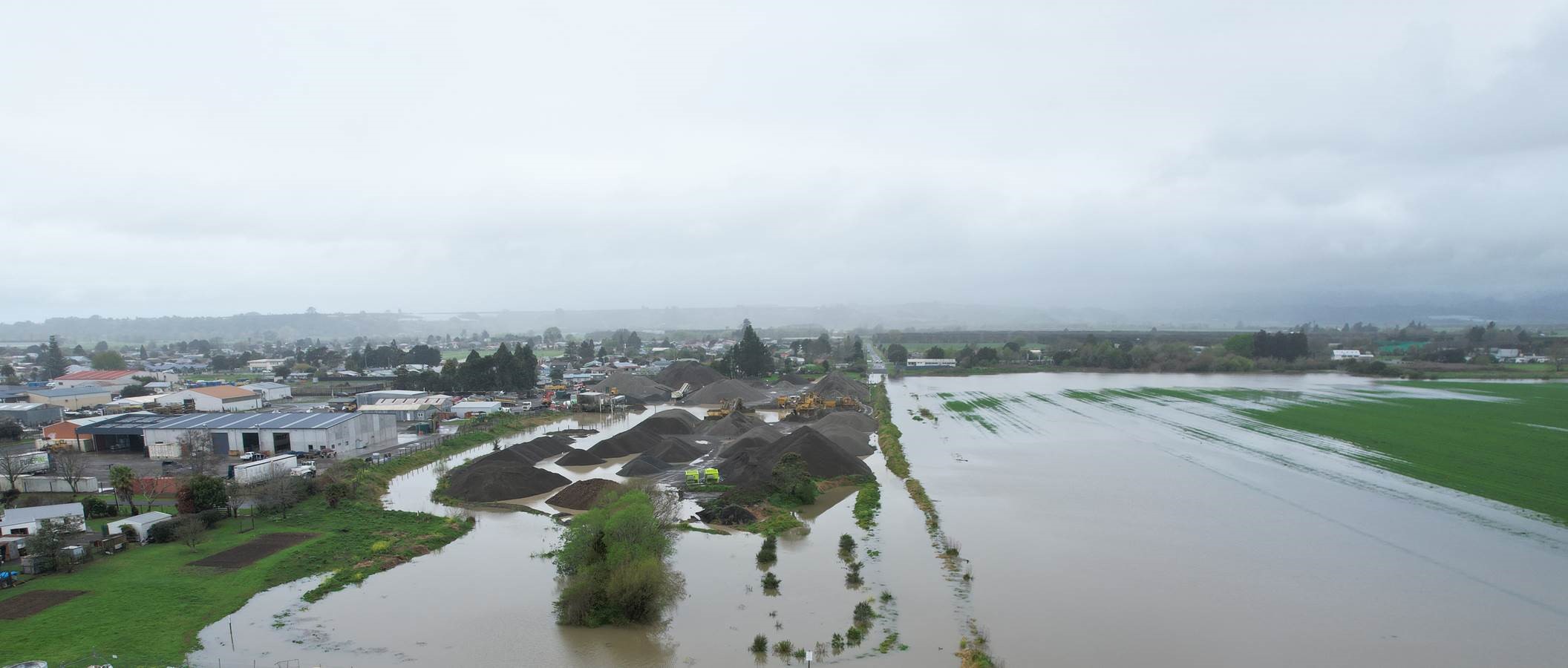 Aerial view showing flooded paddocks at the southern end of Opotiki township