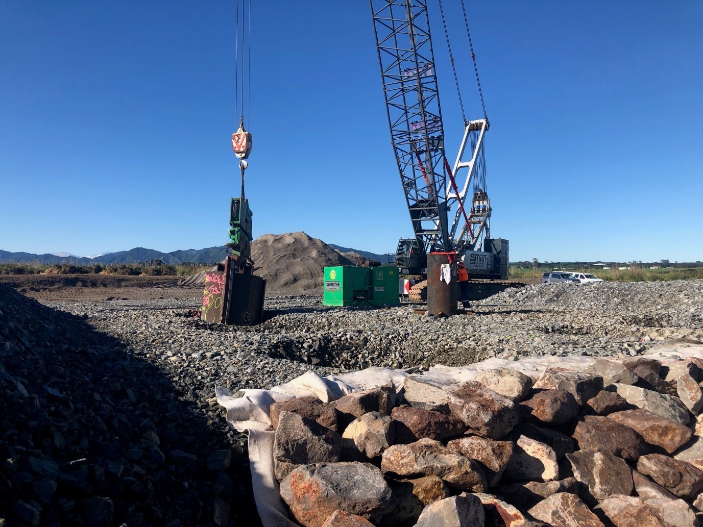 Cranes working at harbour project site for dynamic compaction trials.