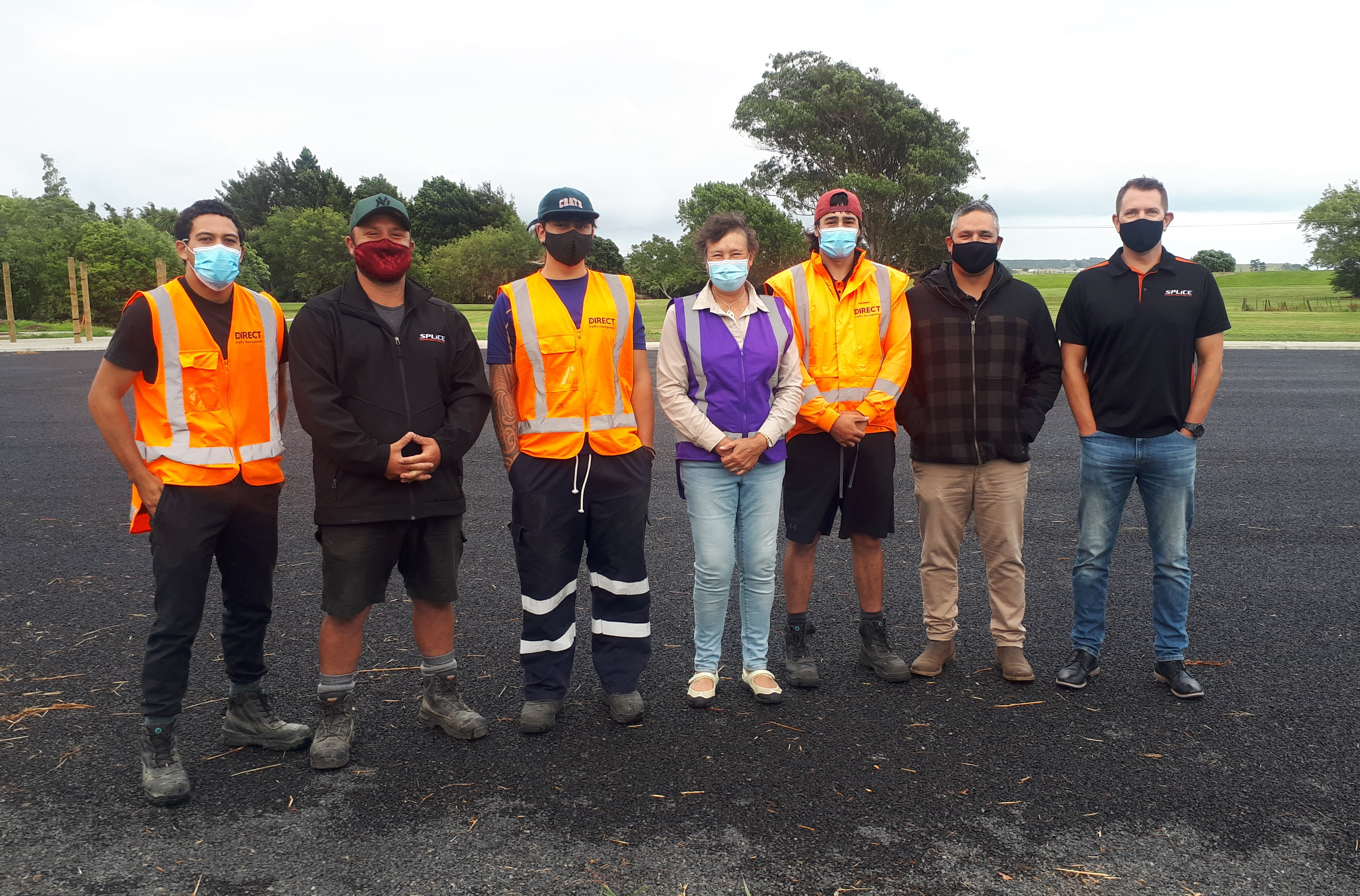 Mayor Lyn Reisterer with Mayors' Taskforce for Jobs subsidy recipients Vhance, Darrian, and Te Huaki, as well as their supervisors, on the brand new parking lot they helped make