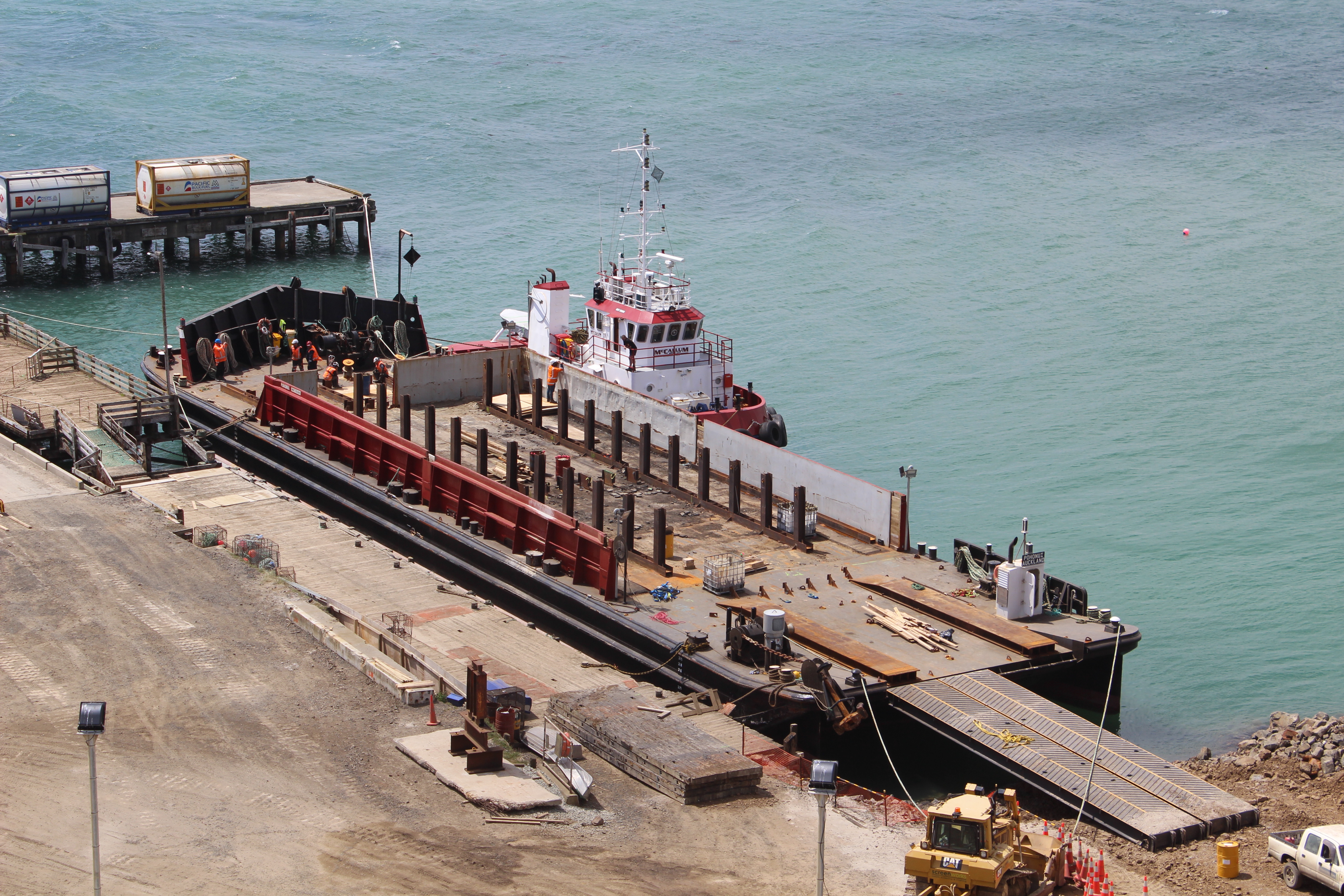 Large barge tied up at a wharf in the Chatham Islands where Pohunui worked on a previous job.